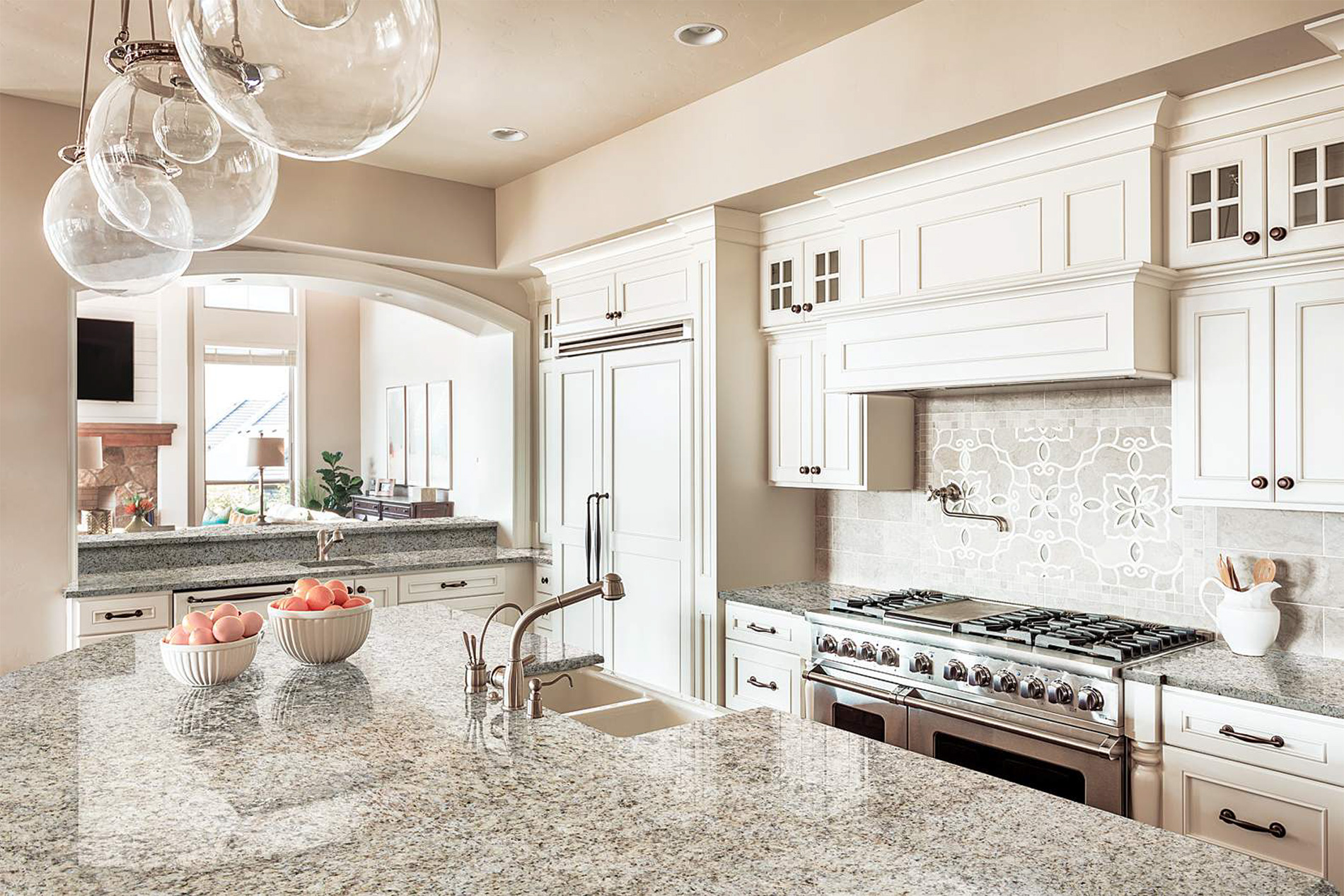 Traditional kitchen renovation with granite counters and range