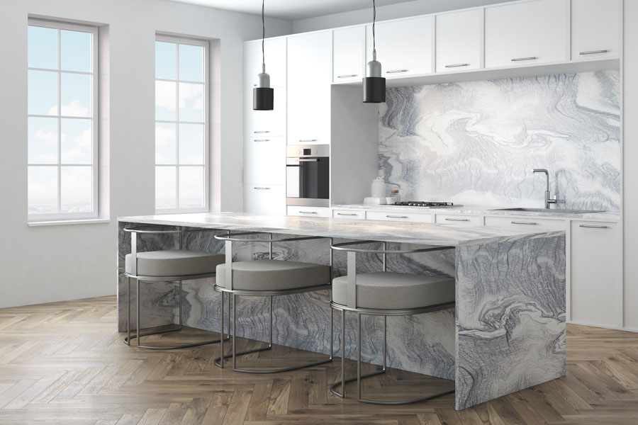 Showroom island with marble surfaces and pendant lighting